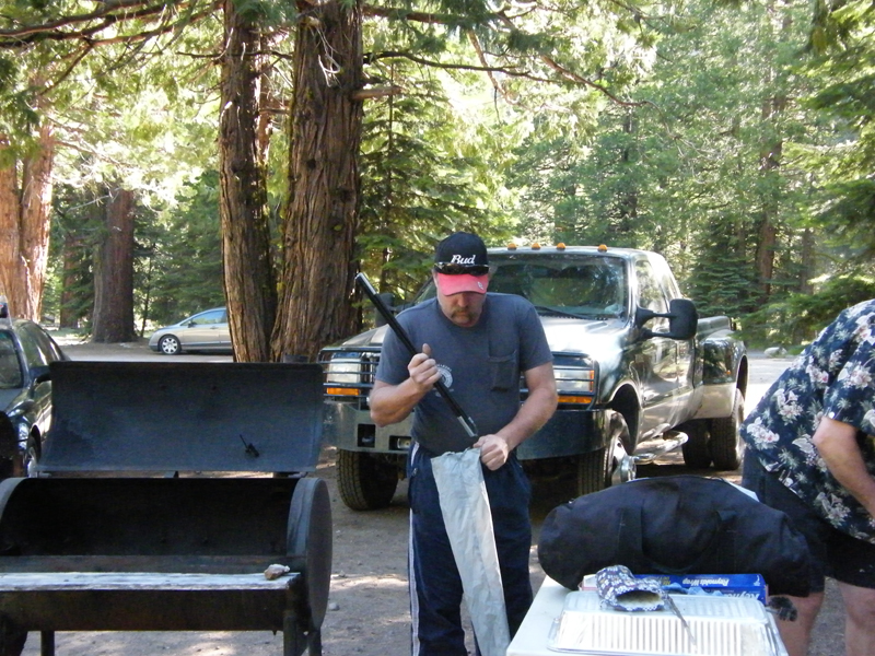 George packing up his tent poles